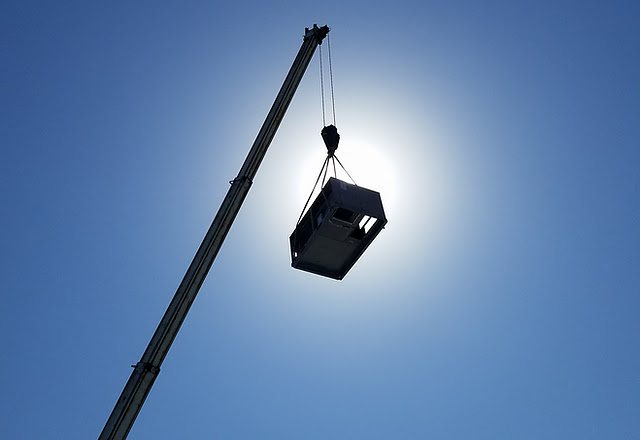 Velocity Air technician servicing an outdoor condenser